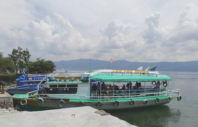 Strolling around Lake Toba with a Boat
